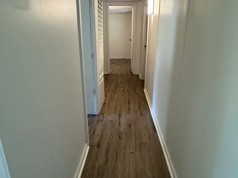 Hallway to bedrooms and bathroom.