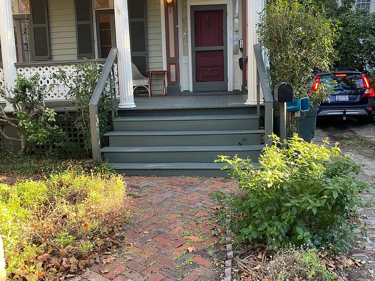 Apartment is behind this house