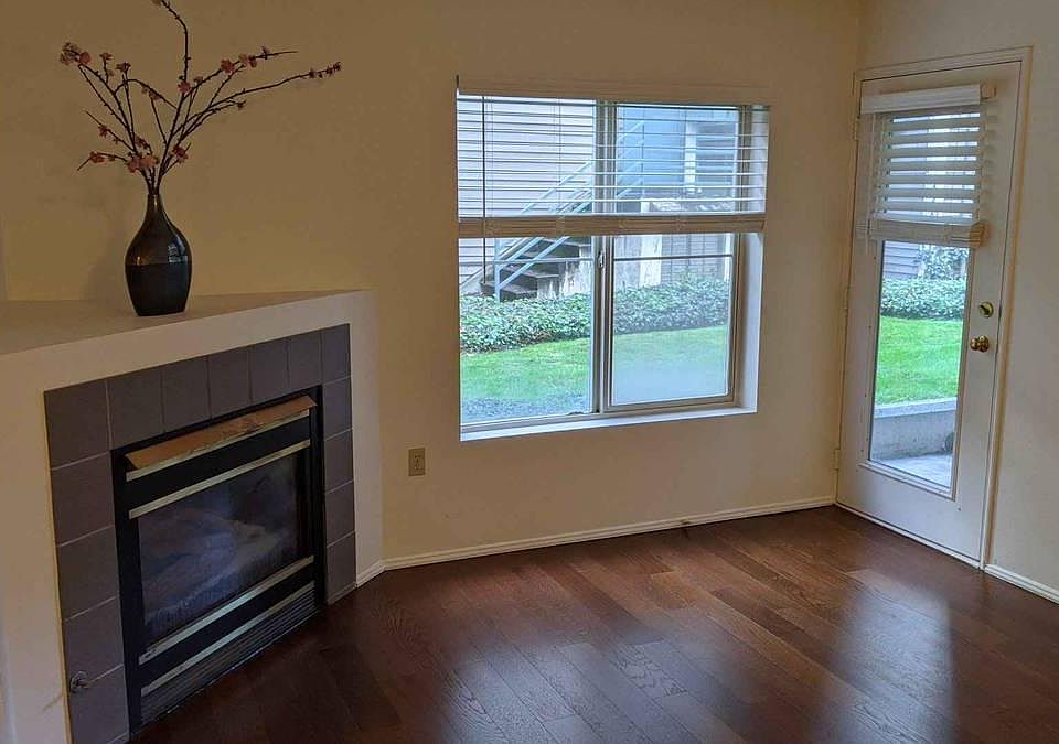 o1 Unit Living room with gas fireplace and French door to patio.