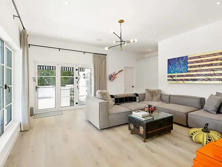 Bright natural light emphasize the high end art displayed through out this incredible property.