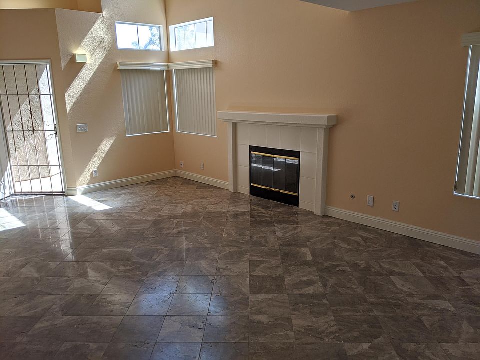 Sunny LR with fireplace, tile flooring