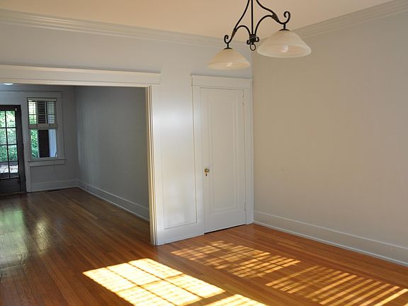 The dining room is adjacent to the living room.