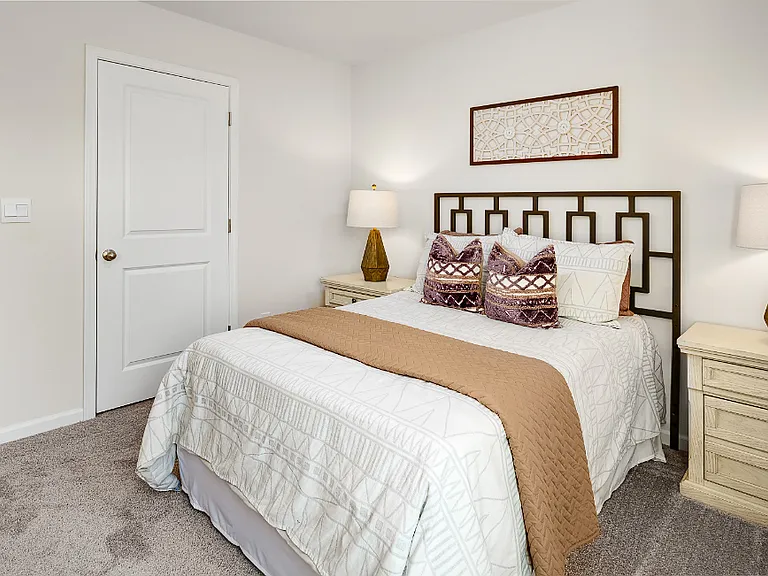 Downstairs Bedroom. Photos are builder provided and do not reflect current furnishings or finishes.