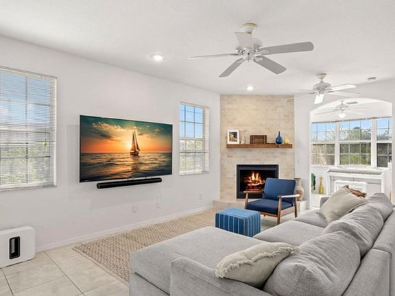 living room with large TV and electric fireplace