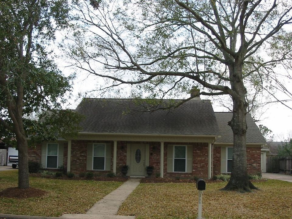 Welcoming brick home with nice open front porch.