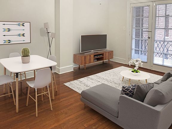 One-bedroom apartment living area (virtually staged)