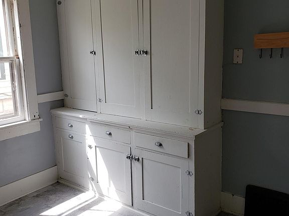 Charming original kitchen cabinets with plenty of storage