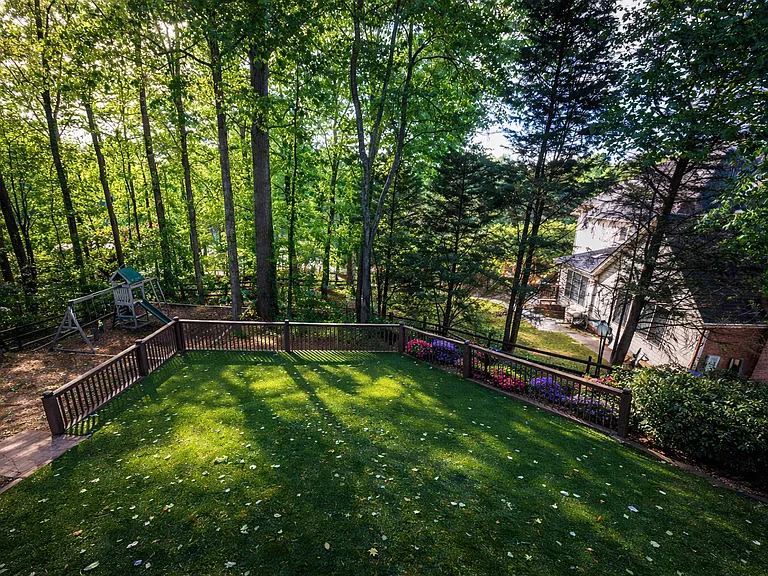 Level backyard with artificial turf + Play area for kids