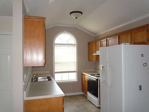 view from living area toward kitchen/eating area