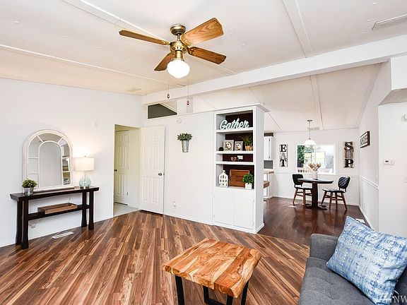 Living room opens into open kitchen and dining room