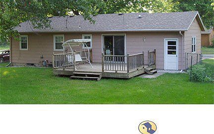 Large deck off kitchen and fenced backyard