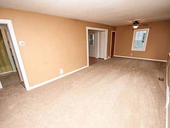 The living room (17x12) and dining room (12x7) flow into one another and feature brand new carpeting with 3 windows that provide an abundance of natural light into the space.