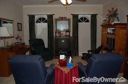 Den/office
						:
						Can be used as a computer room, office or TV room. Custom green silk drapes.