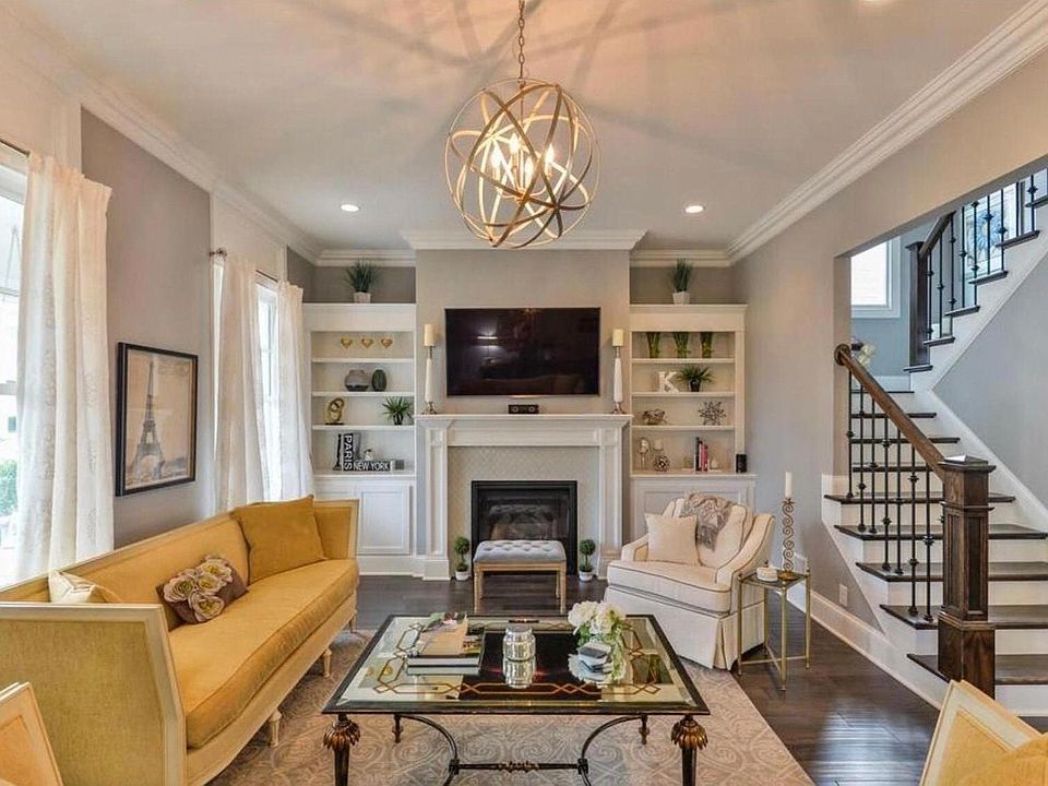 Beautiful living room with custom tile fireplace with stunning hardwood floors