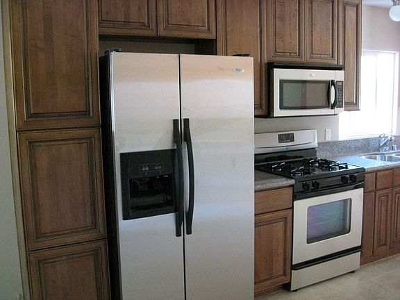 NEW REFRIGERATOR, OVEN STOVE TOP, MICROWAVE, AND DISHWASHER INCLUDED IN PRICE!