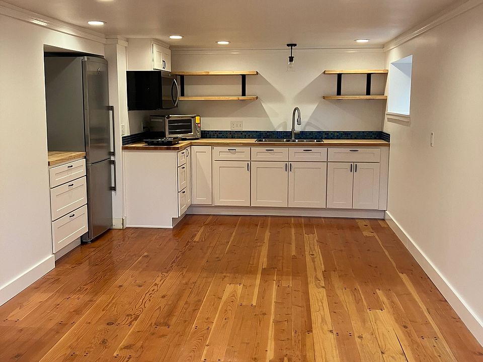 Living room and kitchen. Rug will be added to this space, to protect the floor.