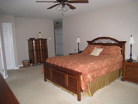 Master suite with double doors, his and hers closets and hallway to office/sit