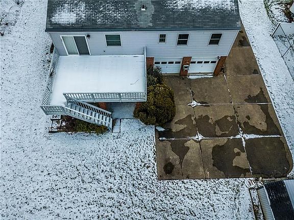 Imagine relaxing on your deck overlooking a wooded back yard.