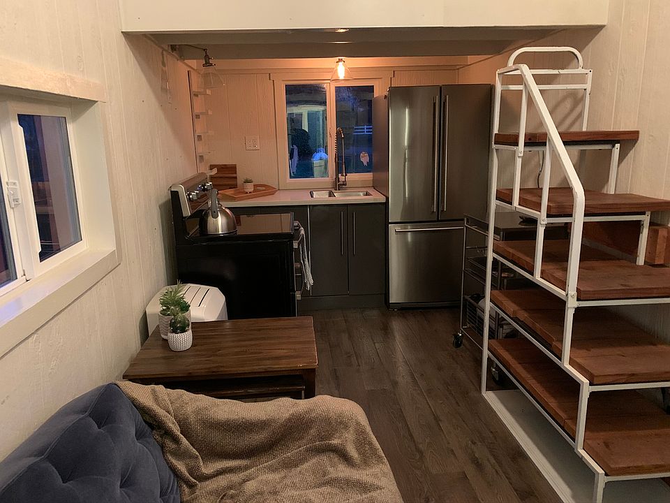 Full-size refrigerator with electric oven and stove.