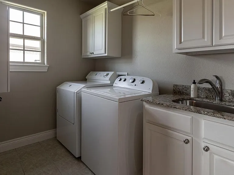 Laundry room includes washer and dryer.