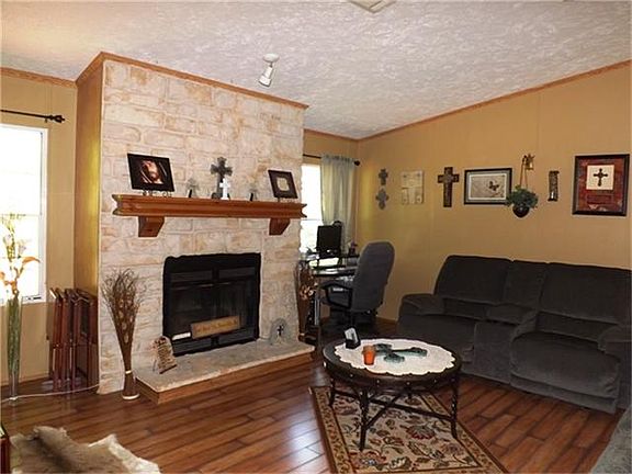 Snuggle and cozy up by your very own stone wood burning fireplace.