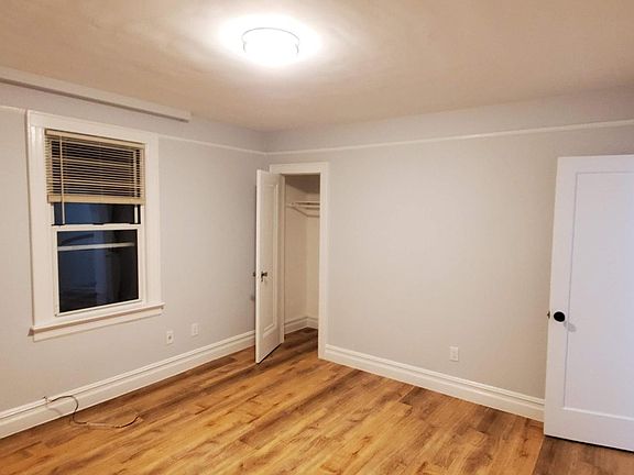 Front room entry door and closet.
The two main rooms on the 2nd floor are approximately 13' x 13' each. They both have closets and 3 windows. The front one is usually used as a living room. The back one is usually used as a bedroom, and has a washer an
