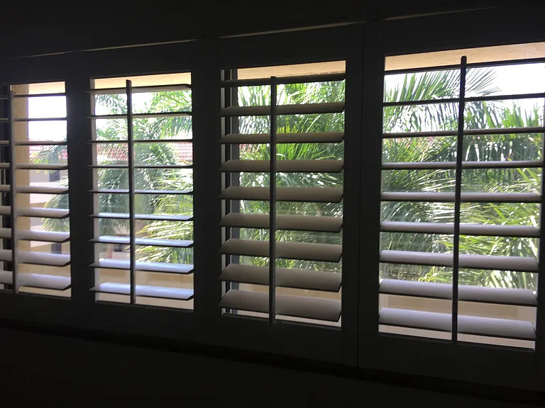Kitchen view to courtyard with privacy shutters