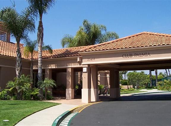 Guard gated entry to the Palmia community