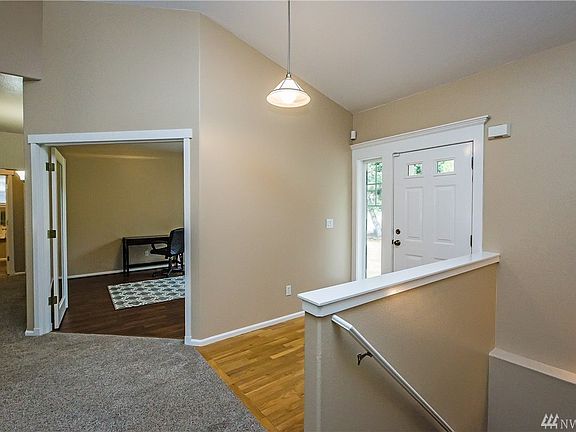 The large office is to your right upon first entering the home.  The stairway, as seen here, leads to the lower level.