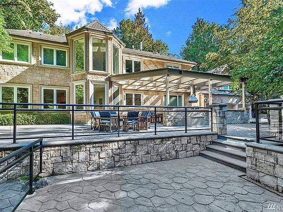 The home sits on 4 walkable acres with huge maples. Two of these 4 acres are past the back fence. 