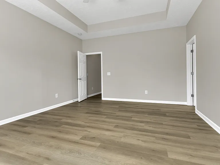 Master Bedroom on the main floor. LV flooring throughout the first floor.