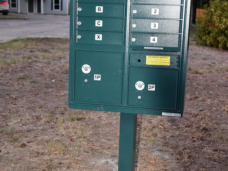 You'll receive a mailbox key (units 1-4 are assigned to Milam Oaks) and there is space for a small package below your box which is also kept locked. As you can see, the duplex townhomes are set far back from the road providing additional privacy & securi