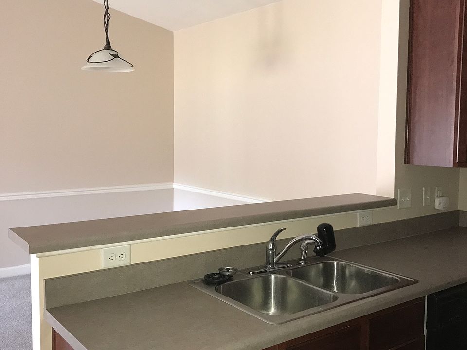 Kitchen with open bar to dining room