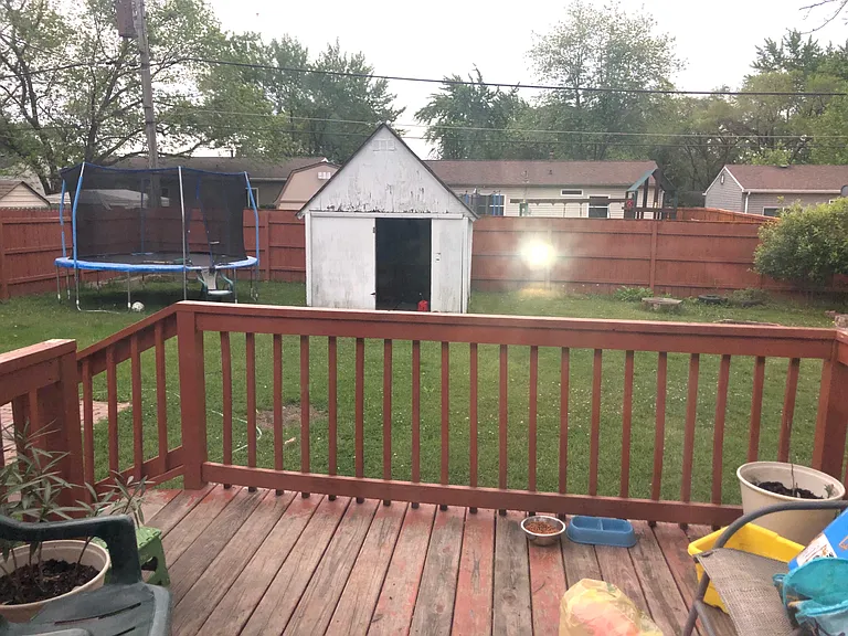 Fully fenced back yard with shed