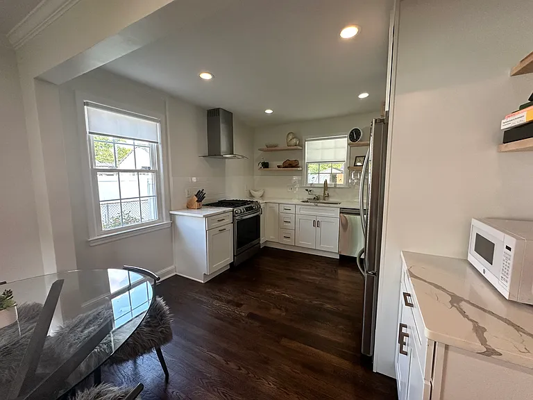 Modern, recently renovated kitchen with stainless appliances