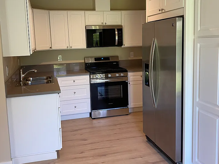 All new Kitchen Cabinets with custom stone tops New Stove / Microwave / Plenty of Cabinet Space / Garbage disposal