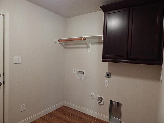 Utility room with built in cabinet