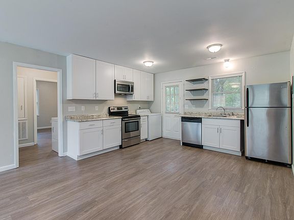 Open kitchen, stainless steel appliances, dishwasher, microwave, laundry washer