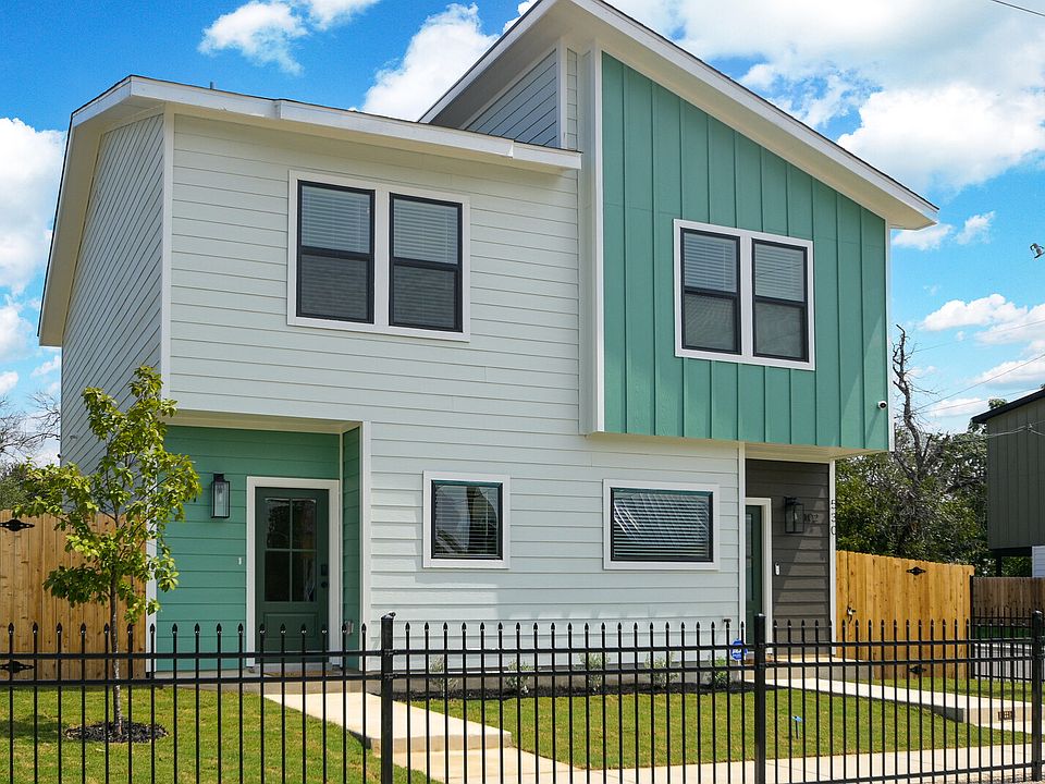 Rod iron fence adorns the front yard while cedar fencing at the back yard provides privacy.