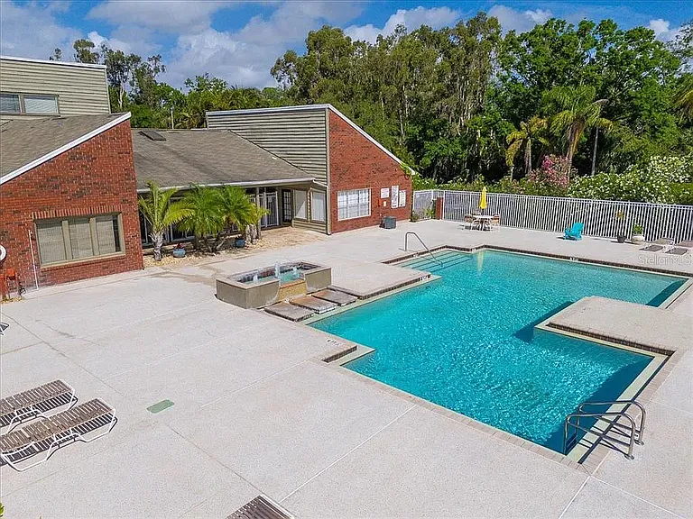 Large pool area with attached modern bathrooms