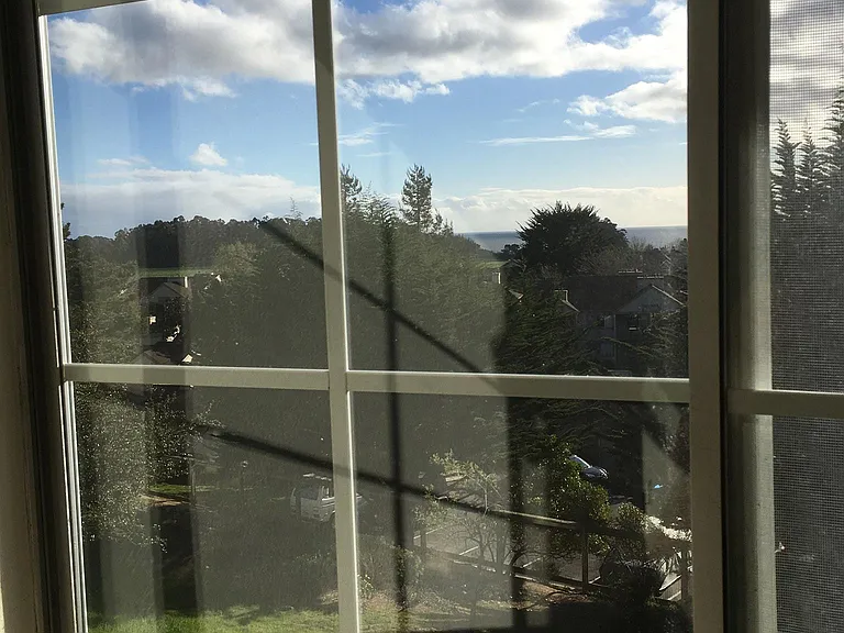 View into green belt and ocean from master bdrm