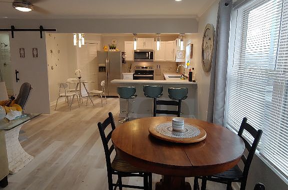 Dining area with expandable table and extra chairs.
