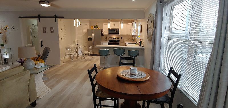 Dining area with expandable table and extra chairs.