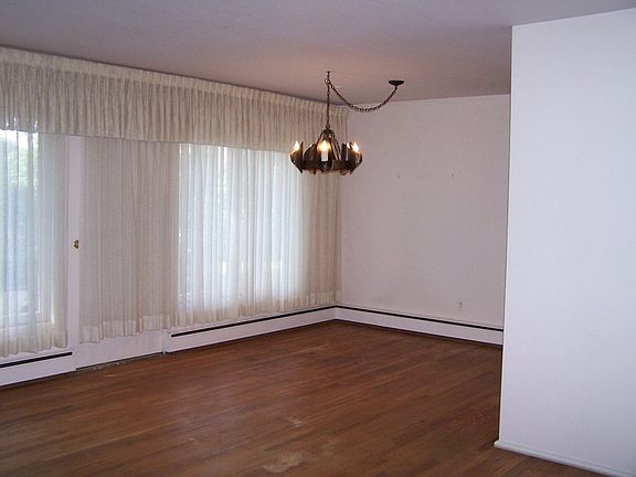 Dining combo with hardwood floors.