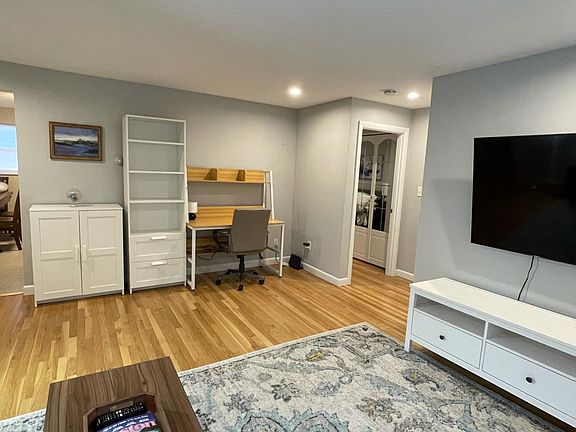Office/Study area with desk, chair, and bookcase