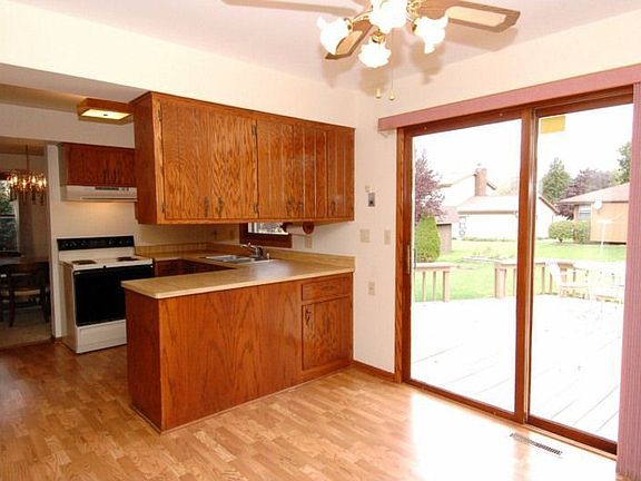 LARGE KITCHEN WITH EATING AREA AND PATIO DOORS