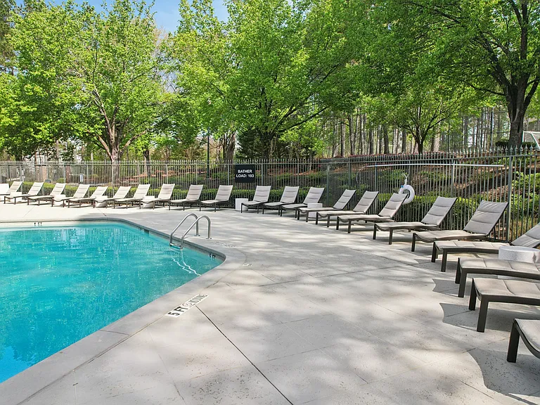 Large Swimming Pool and Chairs at Gwinnett Pointe Apartments in Norcross, GA 30093