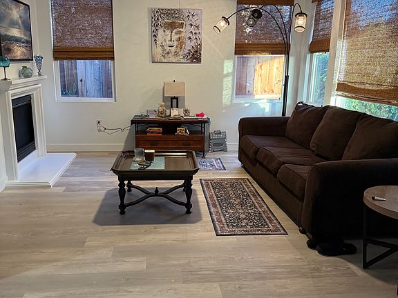 Family room with plenty of windows and gas fireplace