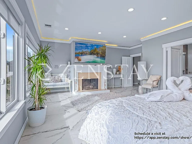 Primary bedroom with sweaping Richardson Bay views