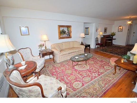 Living room opens to the entry foyer and "L" shape dining room.